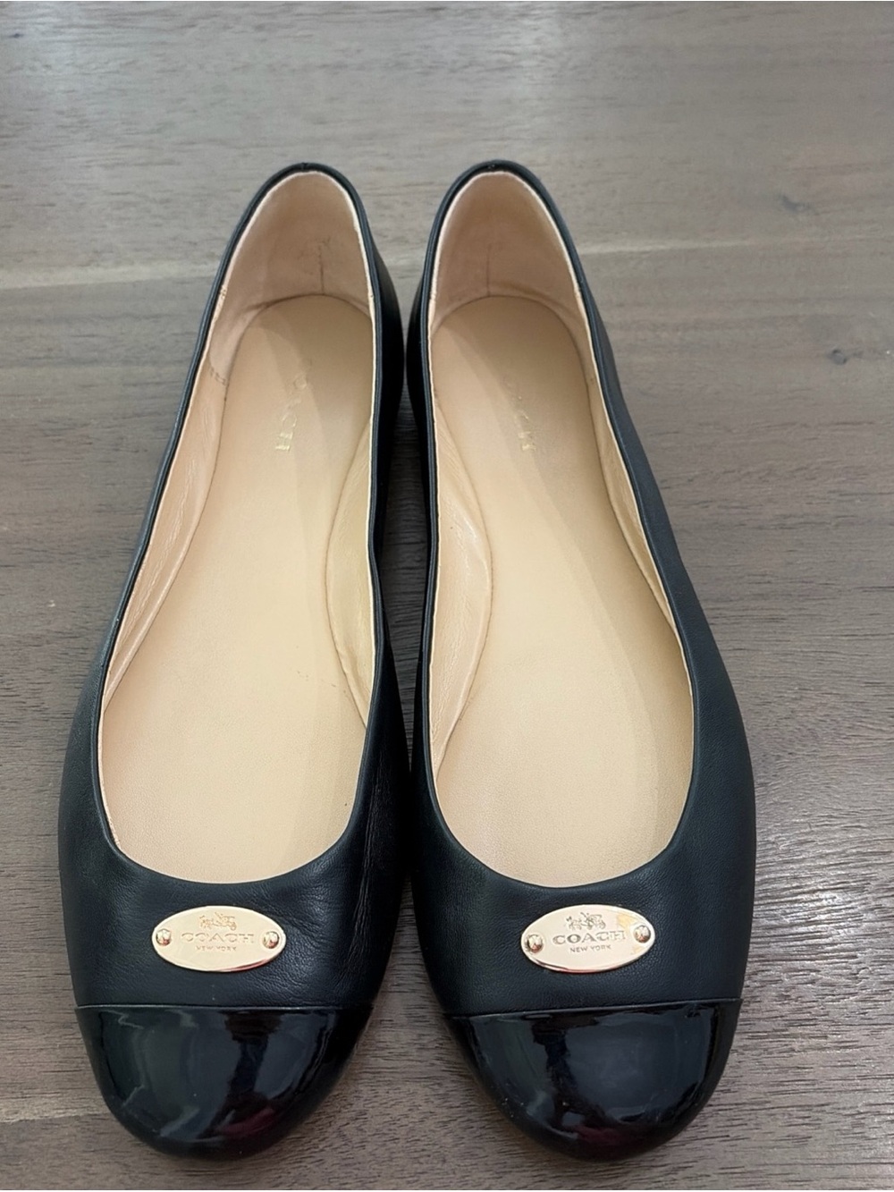 Coach Ashley Black Leather Ballet Flats with Patent Cap Toe and Gold Plaque